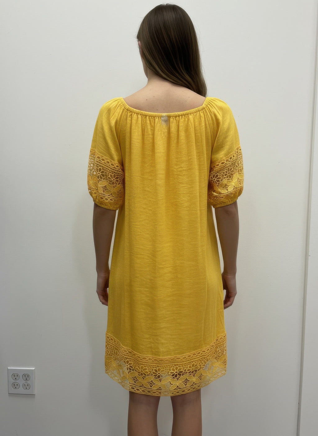 Solid short sleeve dress, lemon yellow, back view with lace-trimmed hem