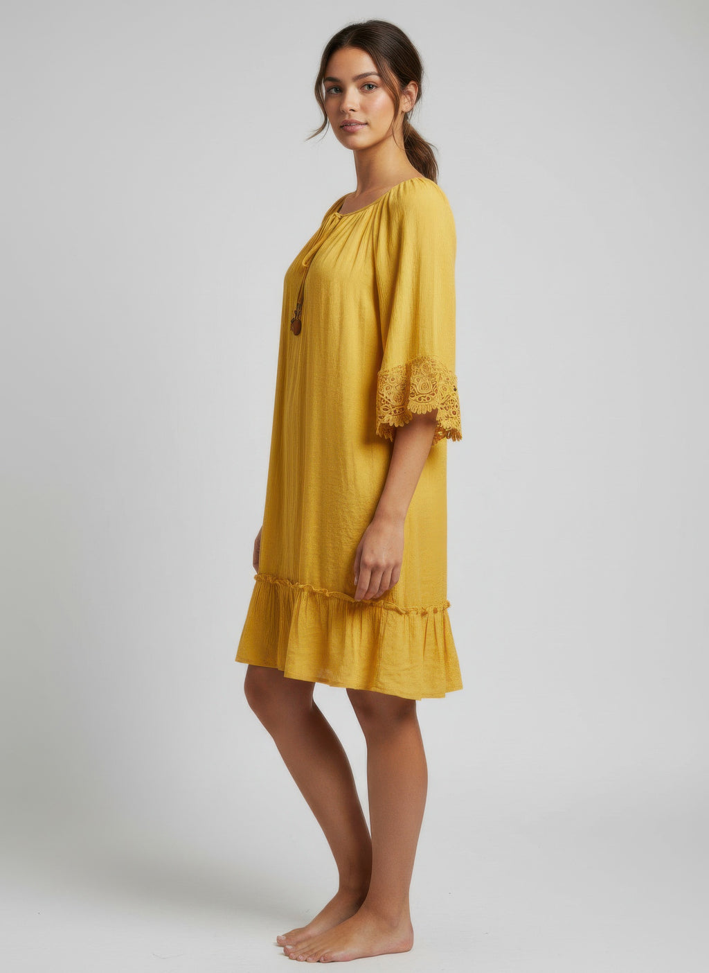 Mustard-gold dress, lace-trim elbow sleeves and tiered hem