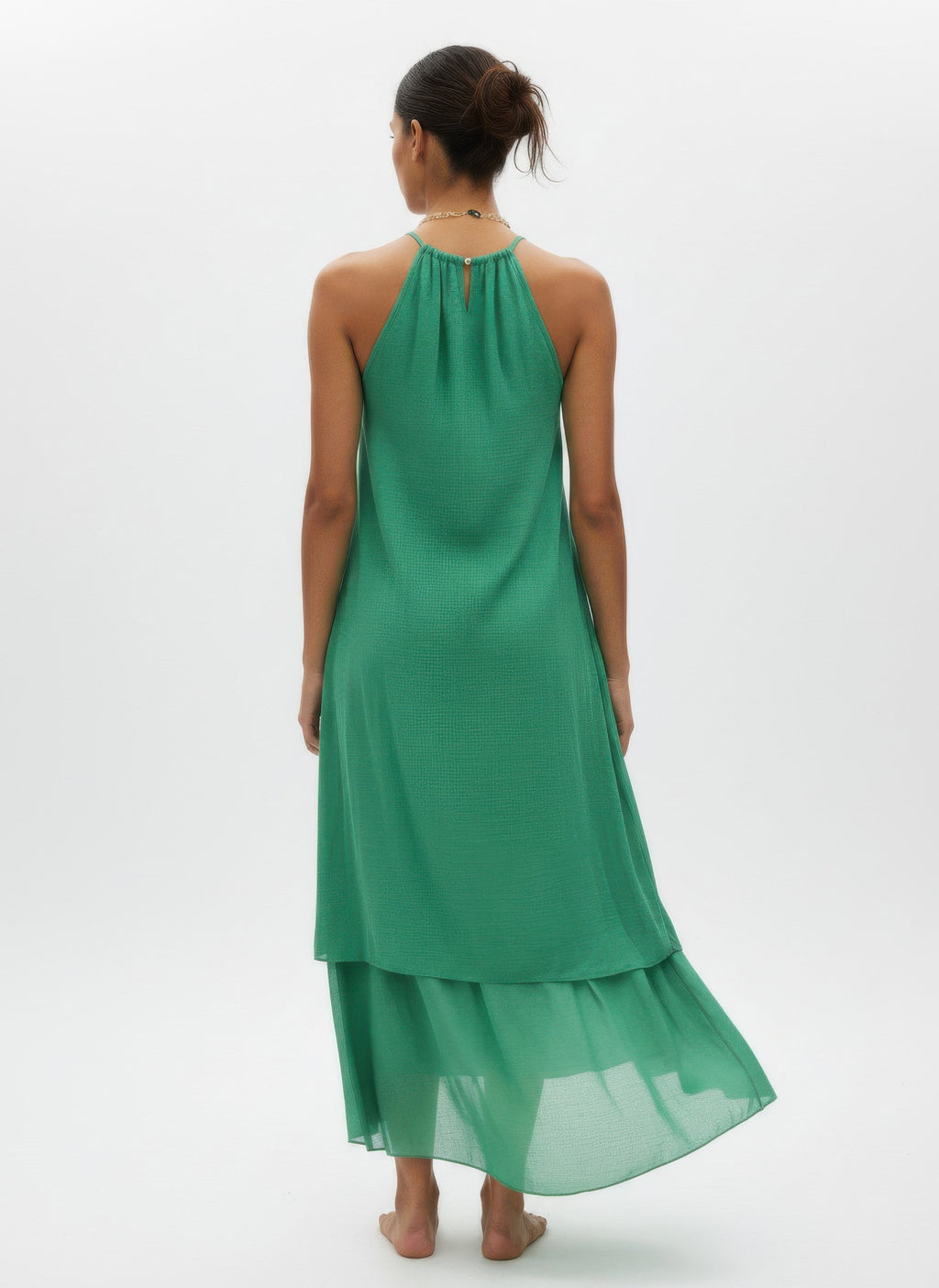 Green sleeveless midi dress, back view, halter neckline with tie and tiered layers