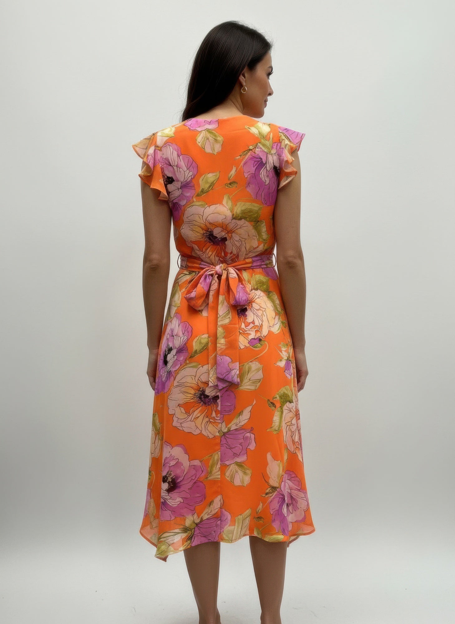 Back view of orange floral dress with ruffled sleeves and bow-tied waist