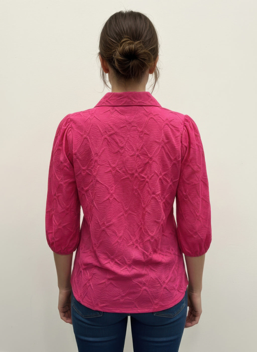 Fuchsia 3/4 sleeve blouse, back view with raised collar and textured fabric