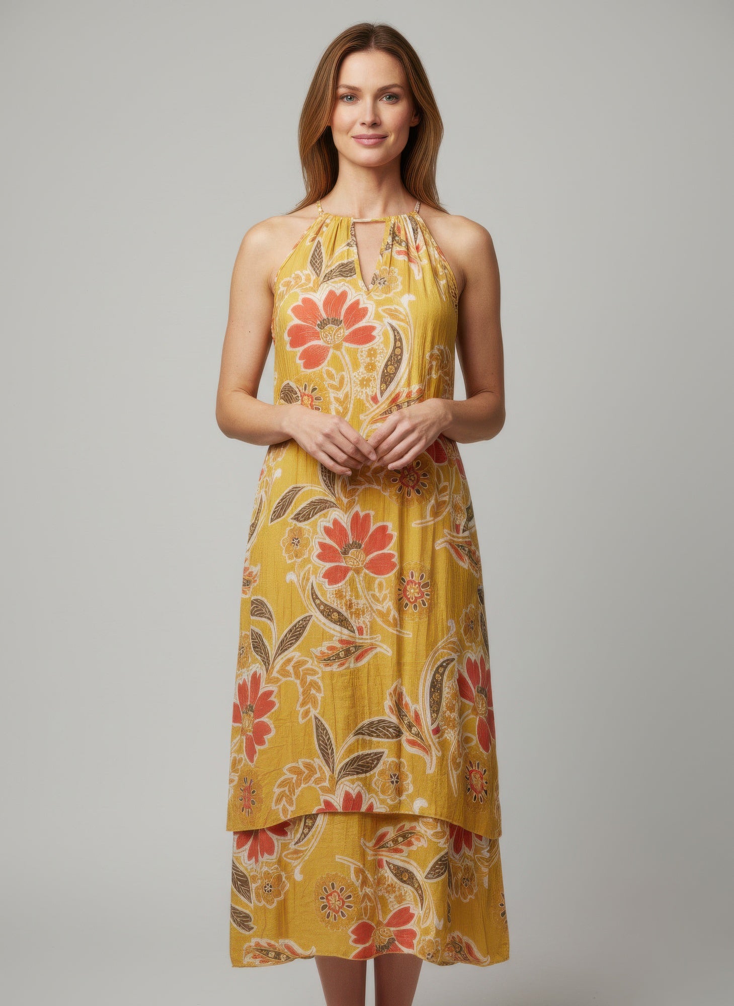 Floral sleeveless dress with halter neckline in mustard yellow and red-orange blooms