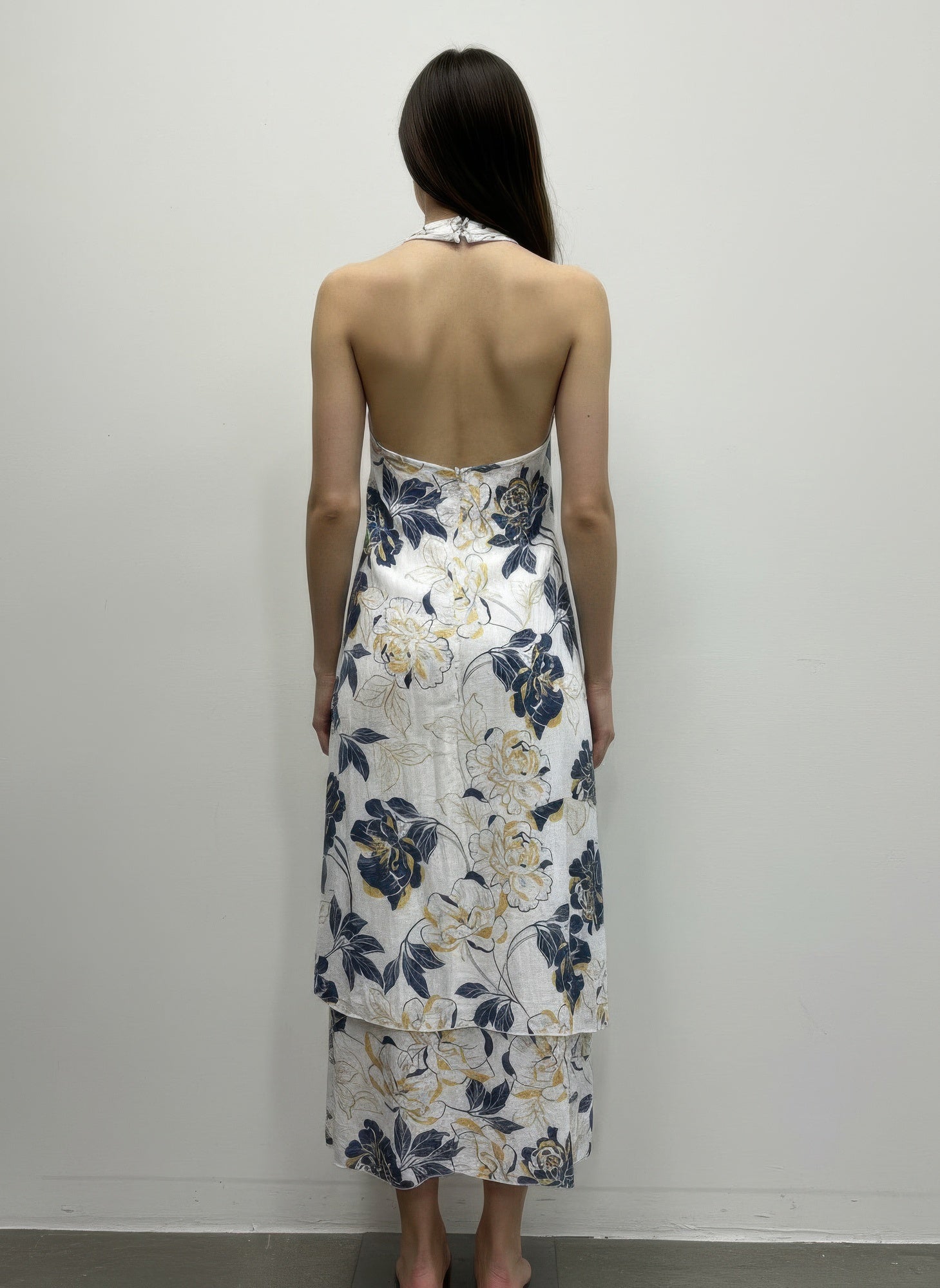 Back view floral sleeveless halter midi dress with open back and blue/yellow blooms