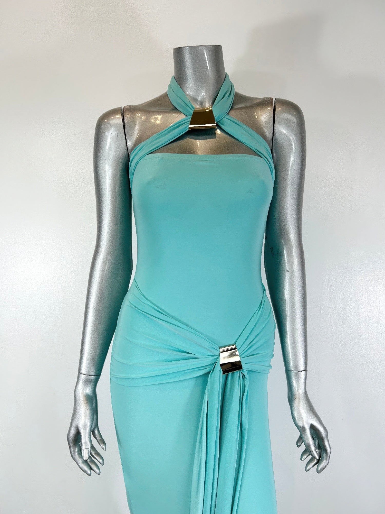 Aqua halter bodycon midi dress close-up, twist drape waist with metal buckle detail