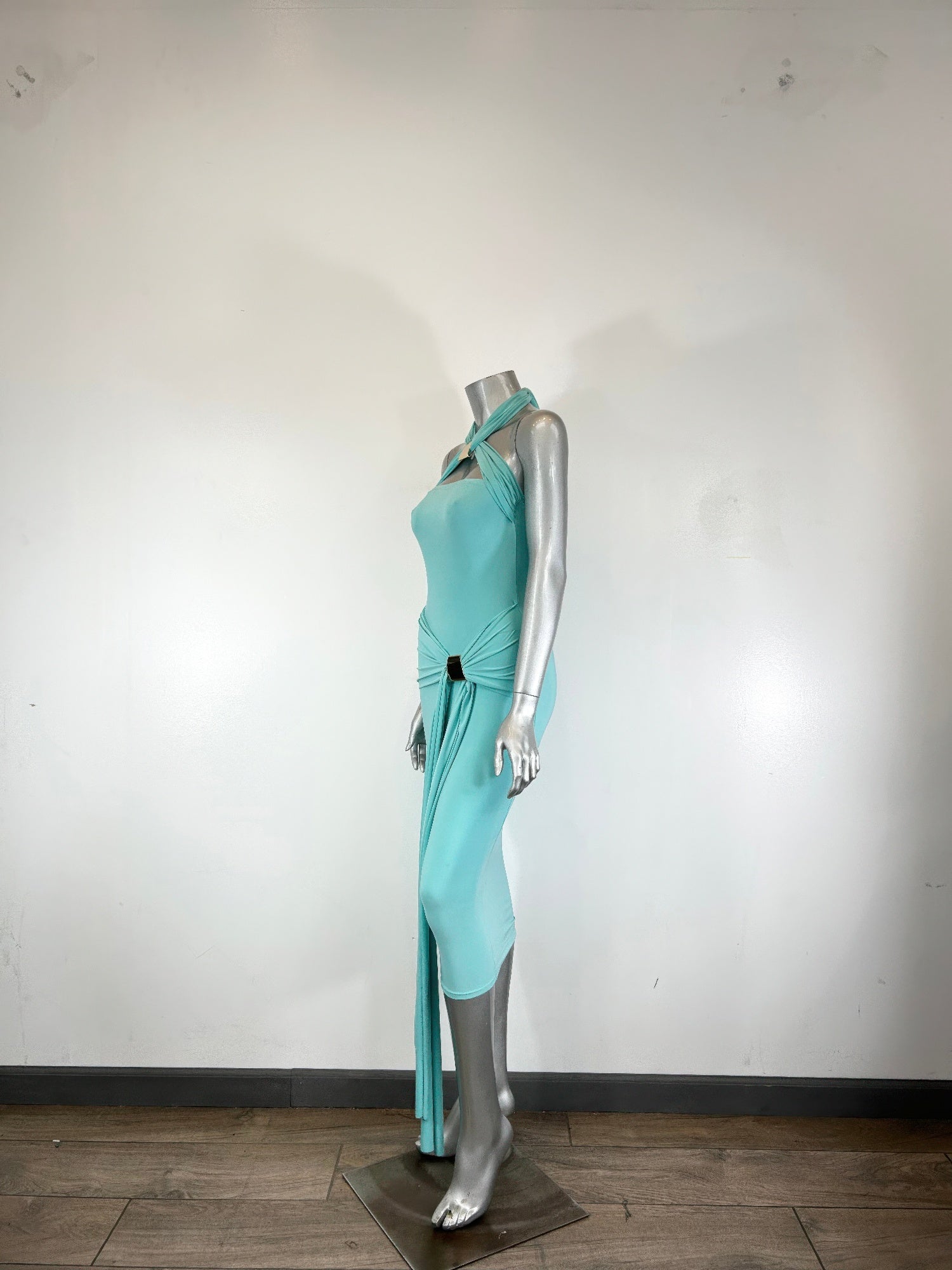 Aqua halter bodycon midi dress, side view with long tie and slit at hem