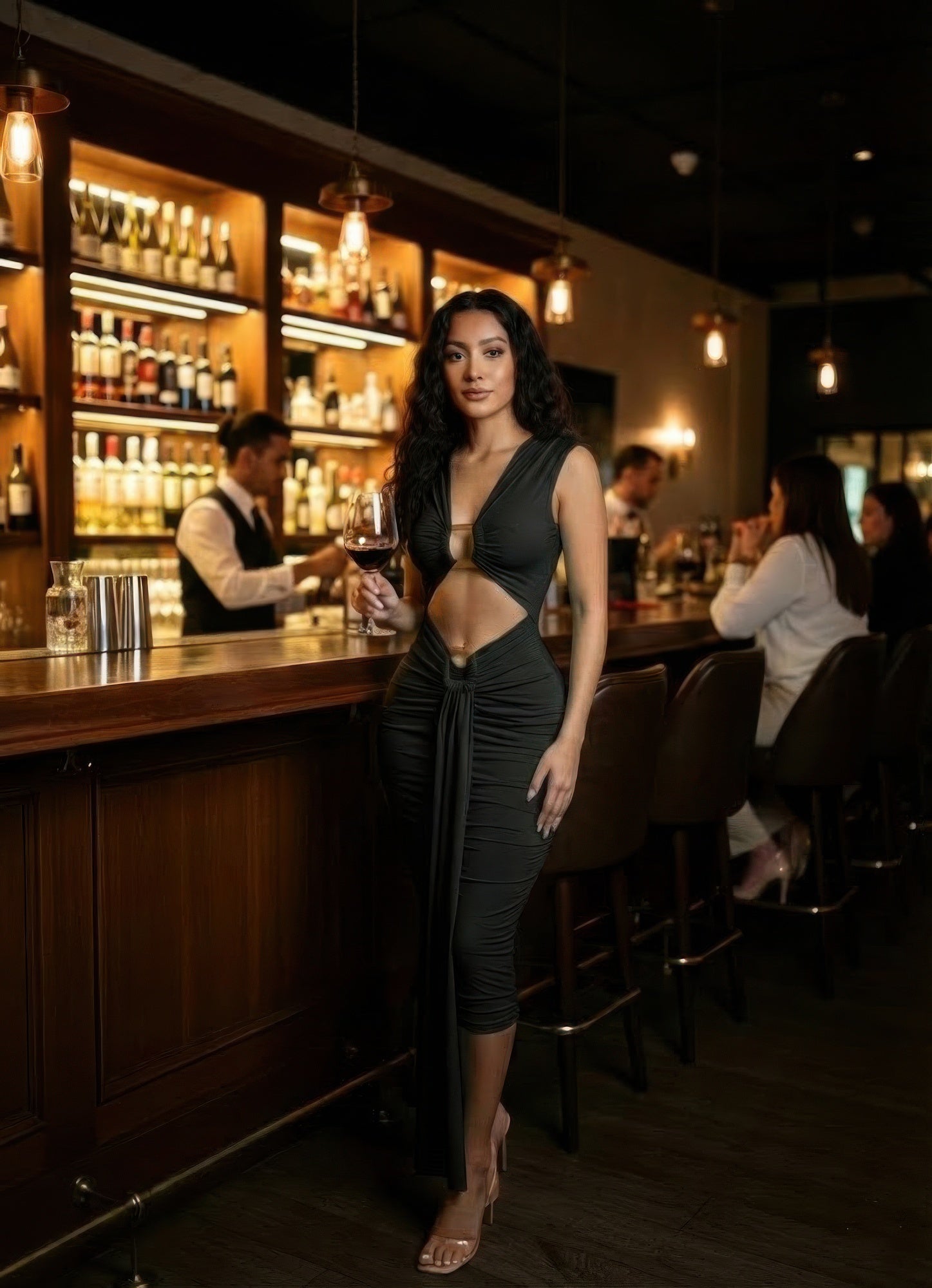 Black bodycon midi dress with deep V neckline, center cut-out, ruched waist