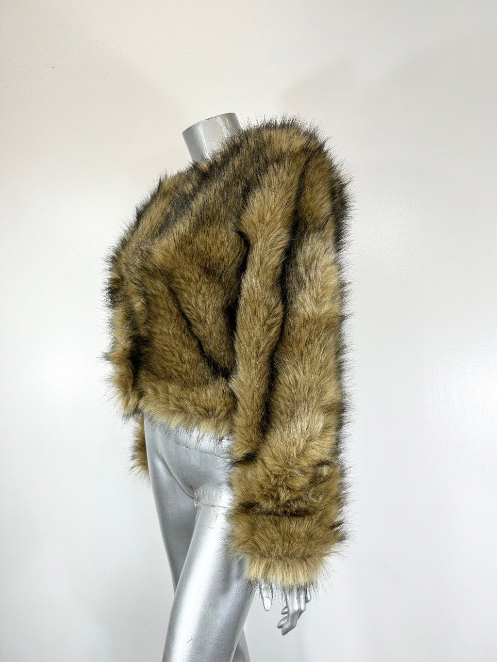 Olive-brown long-pile faux fur jacket close-up of shoulder and sleeve, cuff detail
