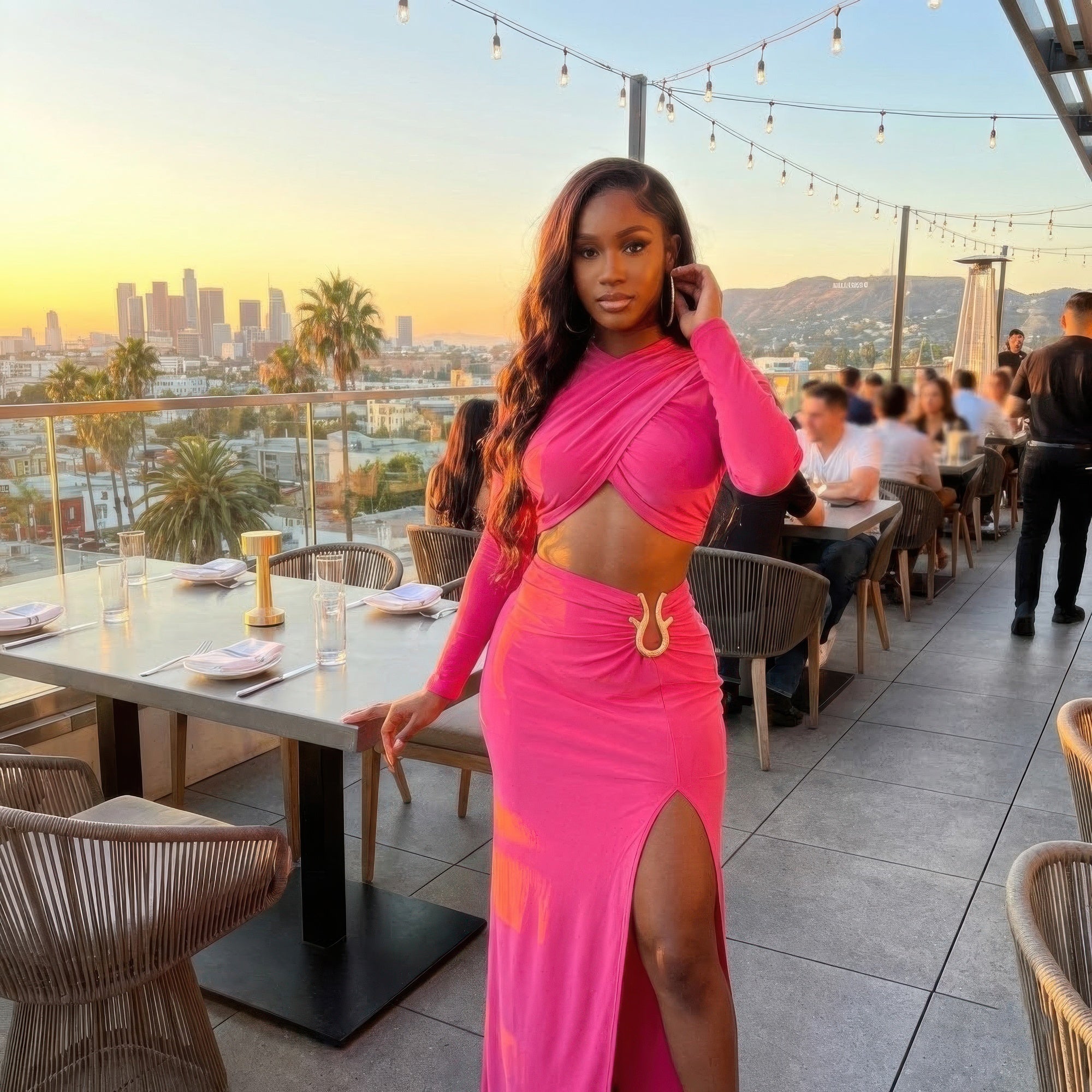 Bubblegum pink high-slit maxi skirt with matching wrap-look long-sleeve crop top