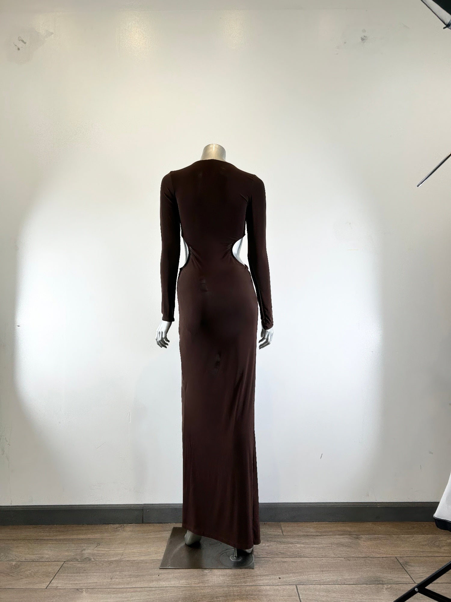 Back view of dark brown mockneck maxi dress on mannequin, long sleeves