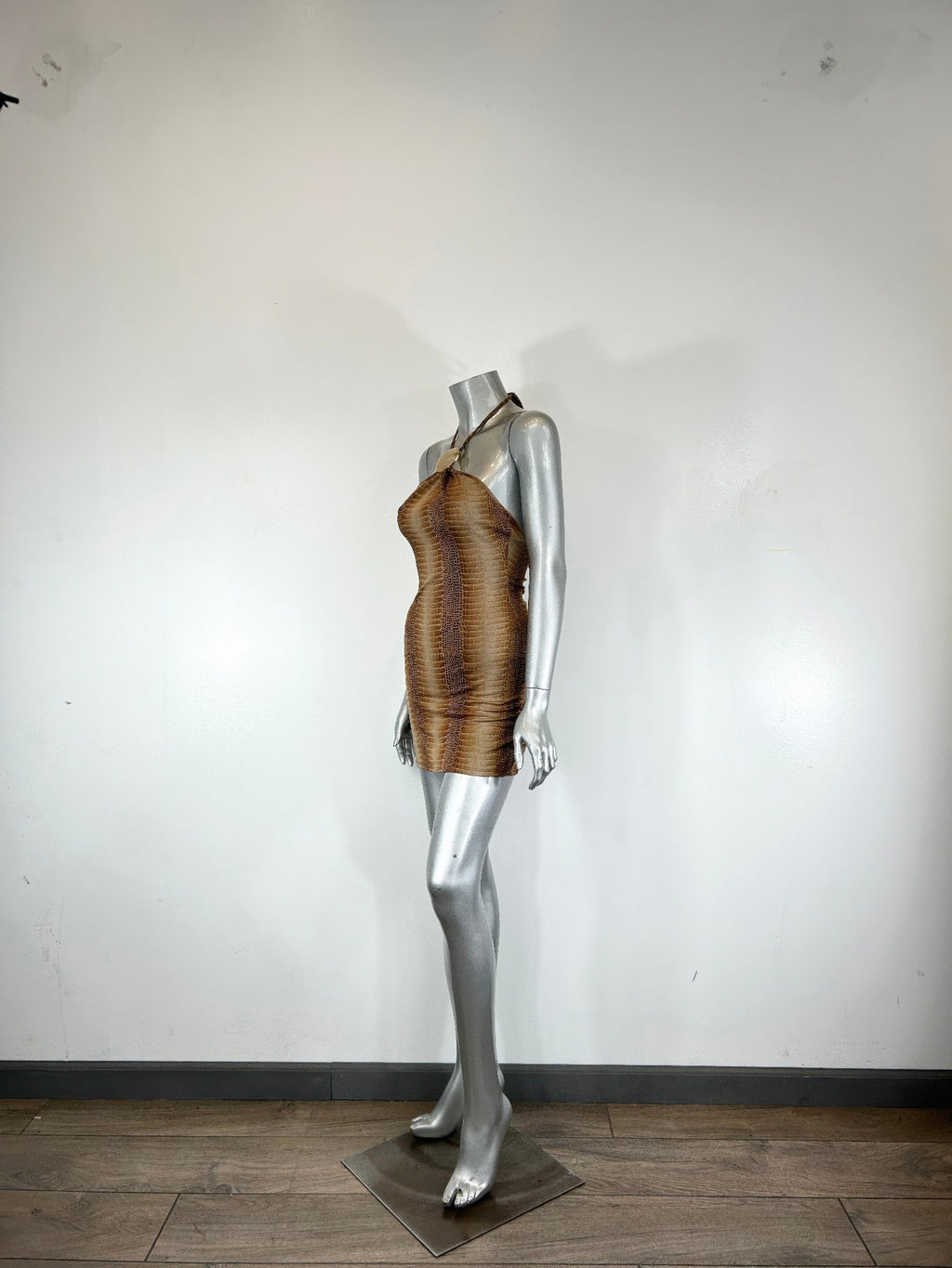 Bronze/gold string neck mini dress with trim detail, side view on mannequin