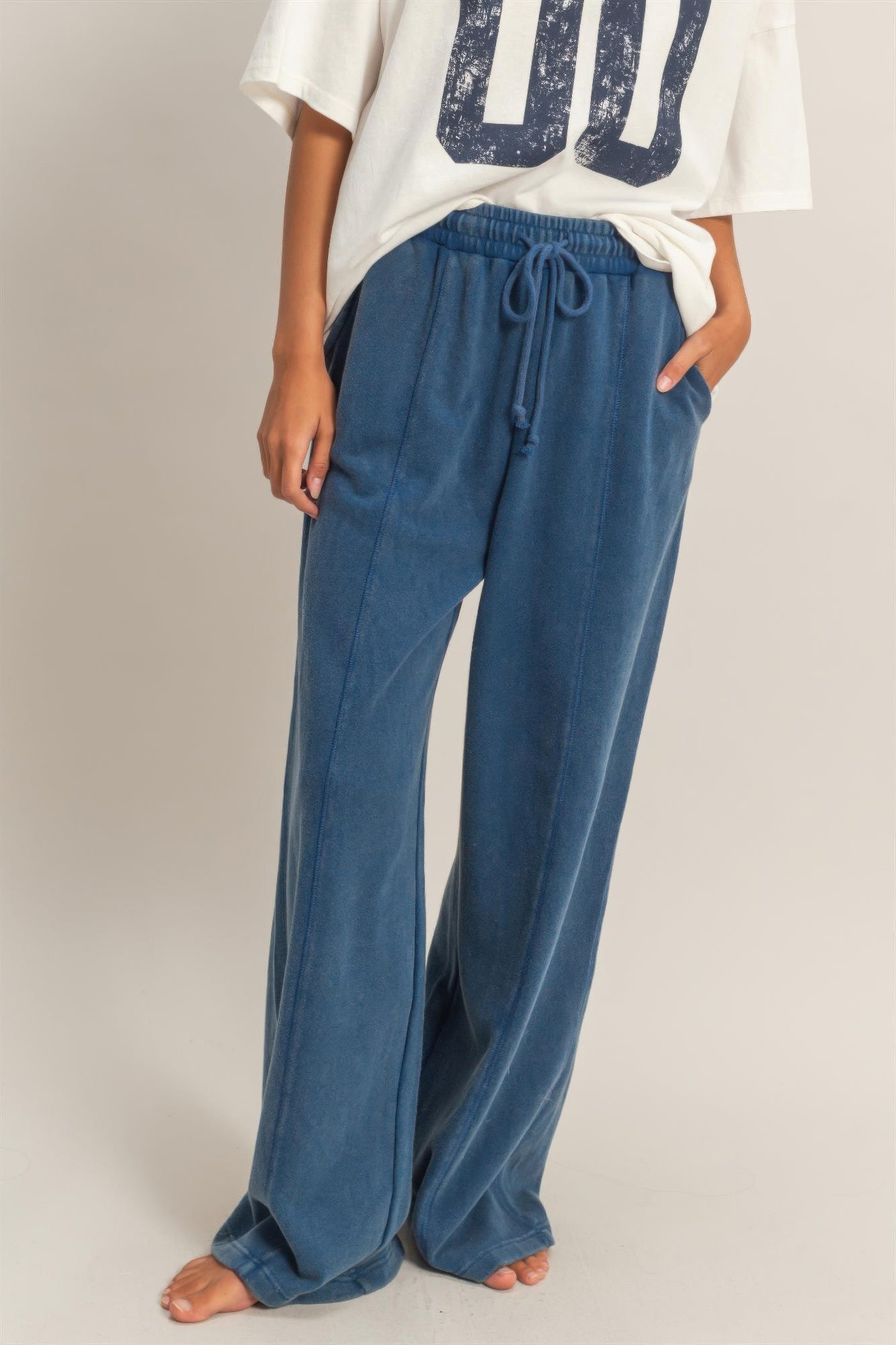 Acid-wash wide-leg French terry pants in blue with drawstring elastic waist