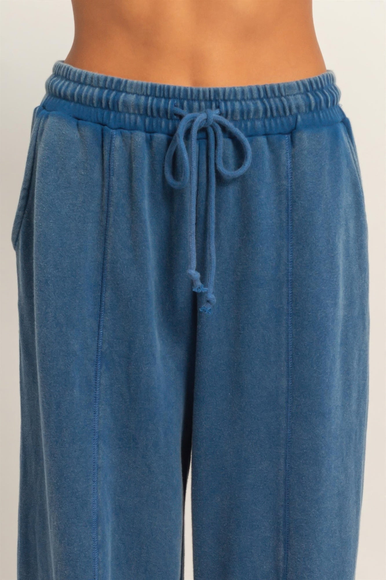 Blue wide-leg pants waistband with drawstring ties and gathered elastic