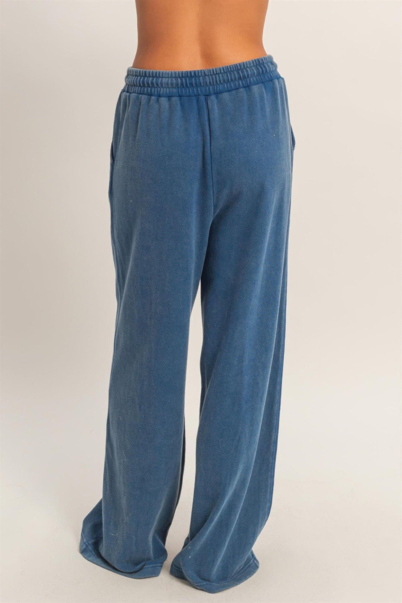 Blue wide-leg French terry pants with elastic waistband and roomy straight legs