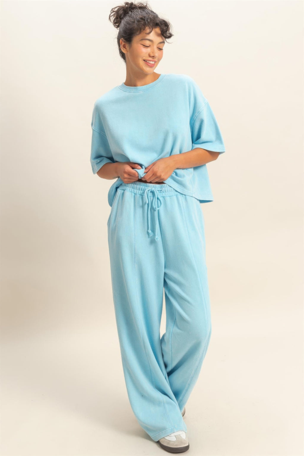 Light blue French terry wide-leg pants, elastic waistband with tied drawstring