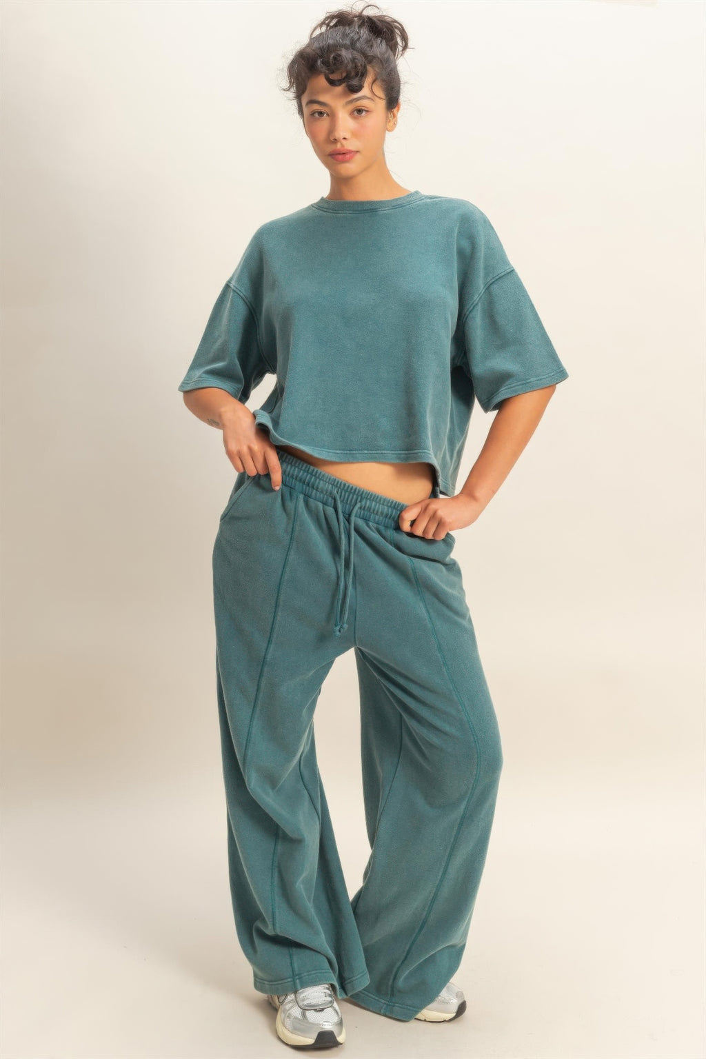 French terry wide-leg pants in dark teal with elastic waistband and drawstring tie
