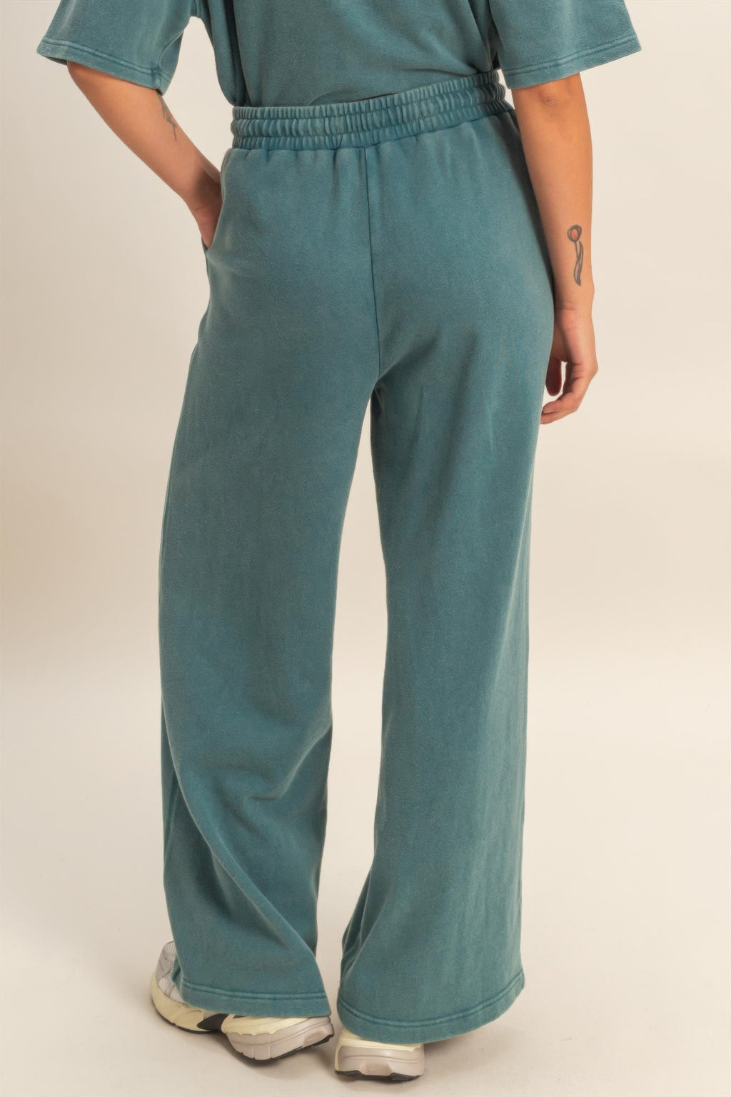 Wide-leg sweatpants in dark teal with relaxed fit and elastic waist, French terry texture