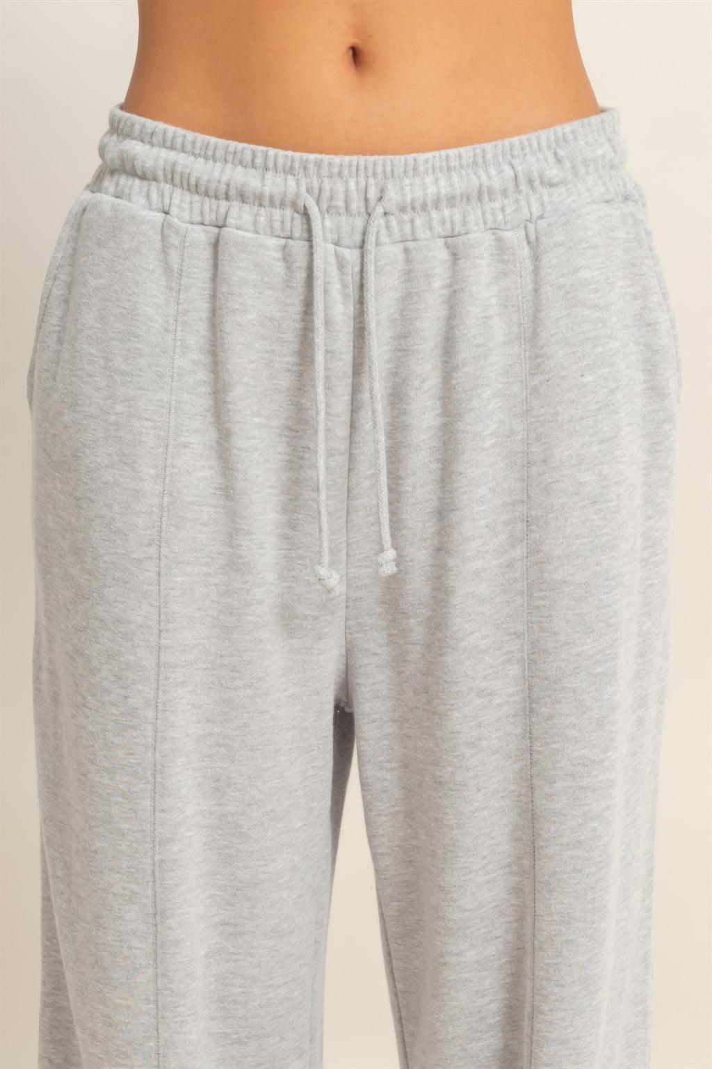 Heather grey French terry pants with elastic waistband and drawstring