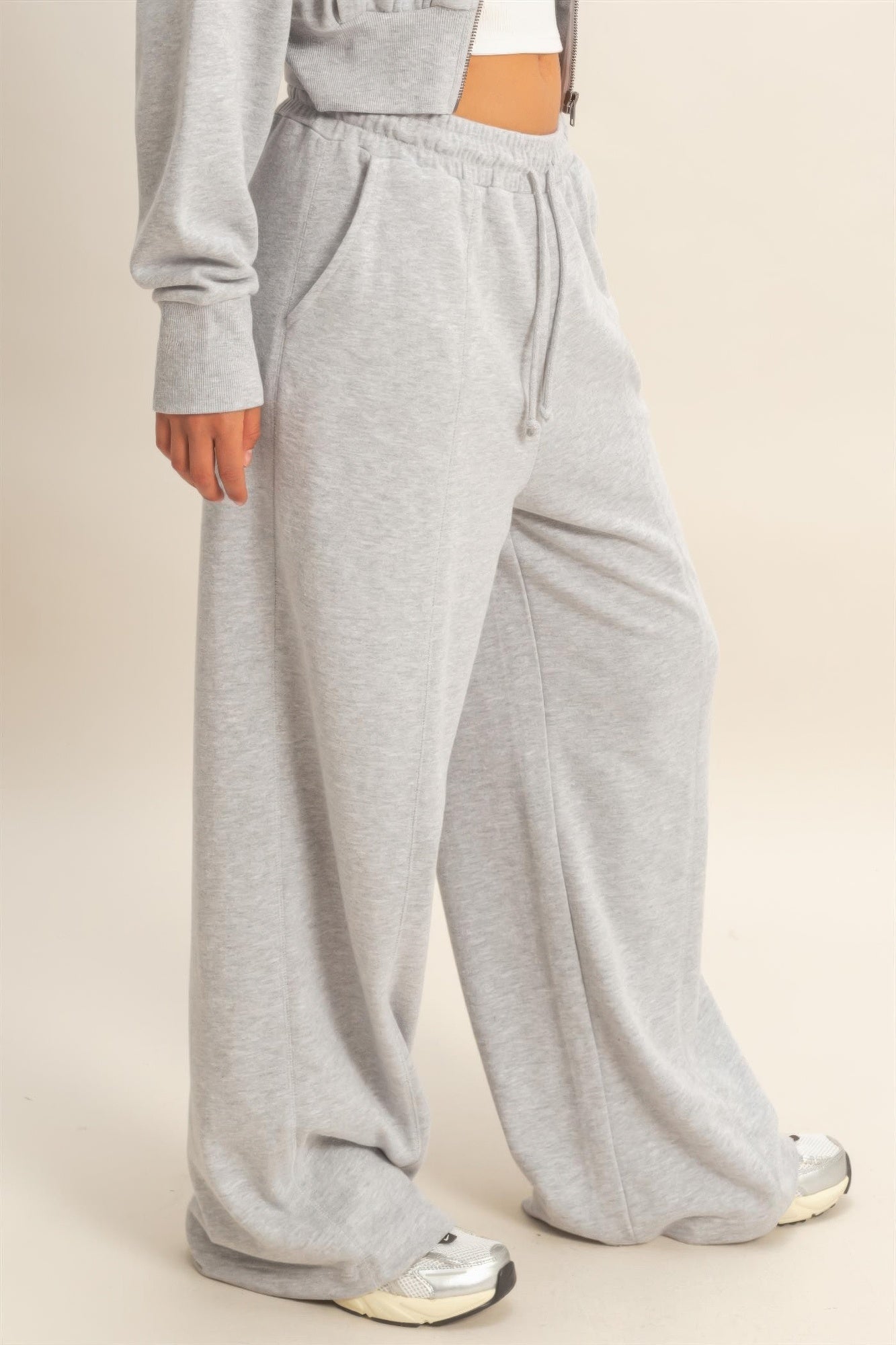 Heather grey wide-leg French terry pants with side seam and drawstring waist