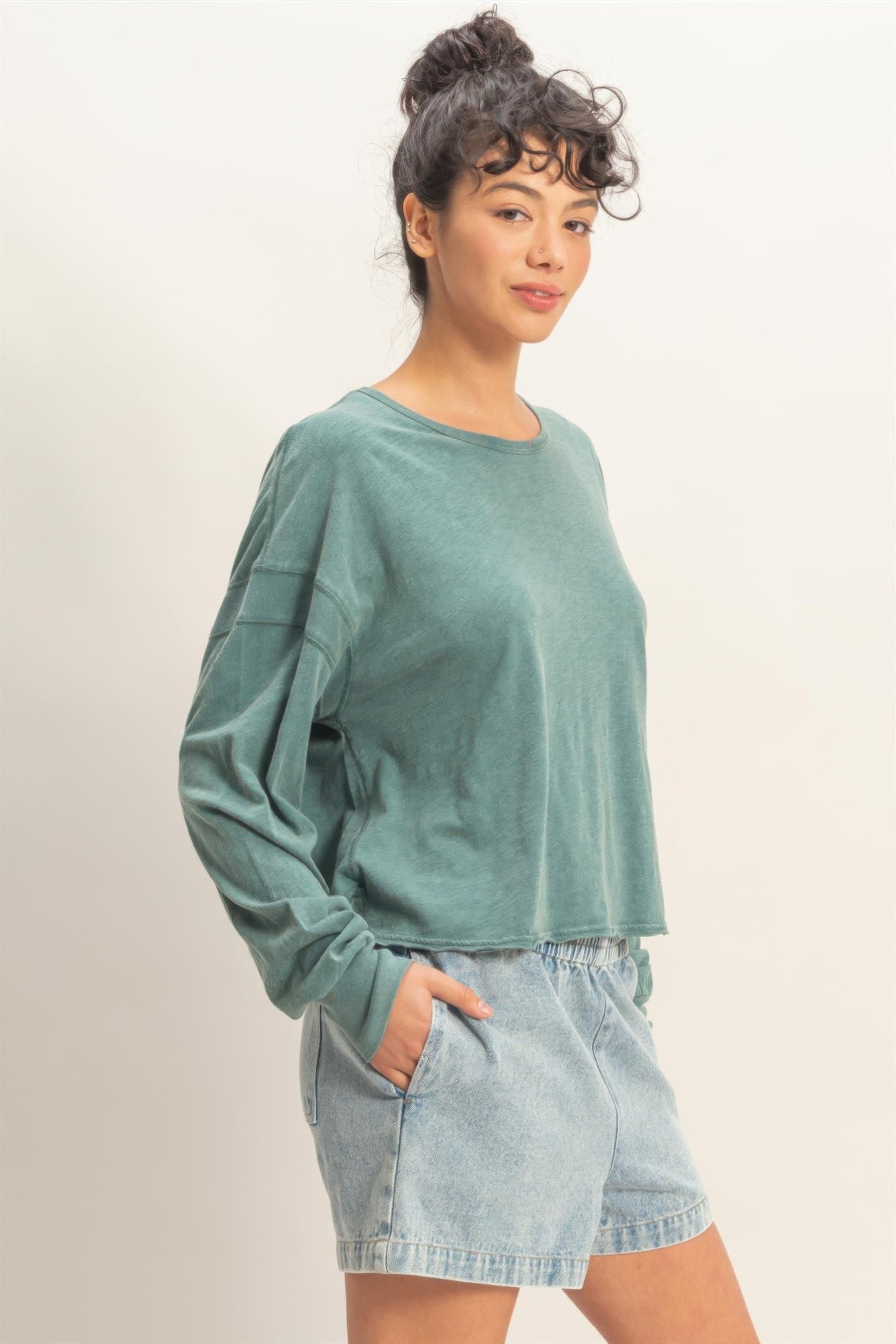 Cross detail open-back long-sleeve top, dark teal with dropped hem