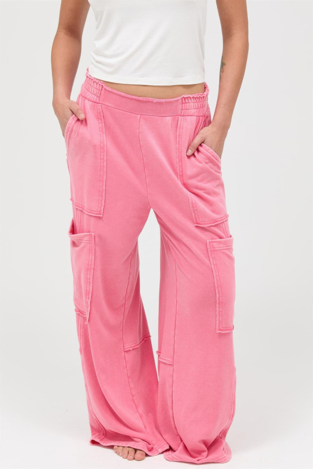 Mineral-wash wide-leg cargo pants, taffy pink, front view with flap pockets