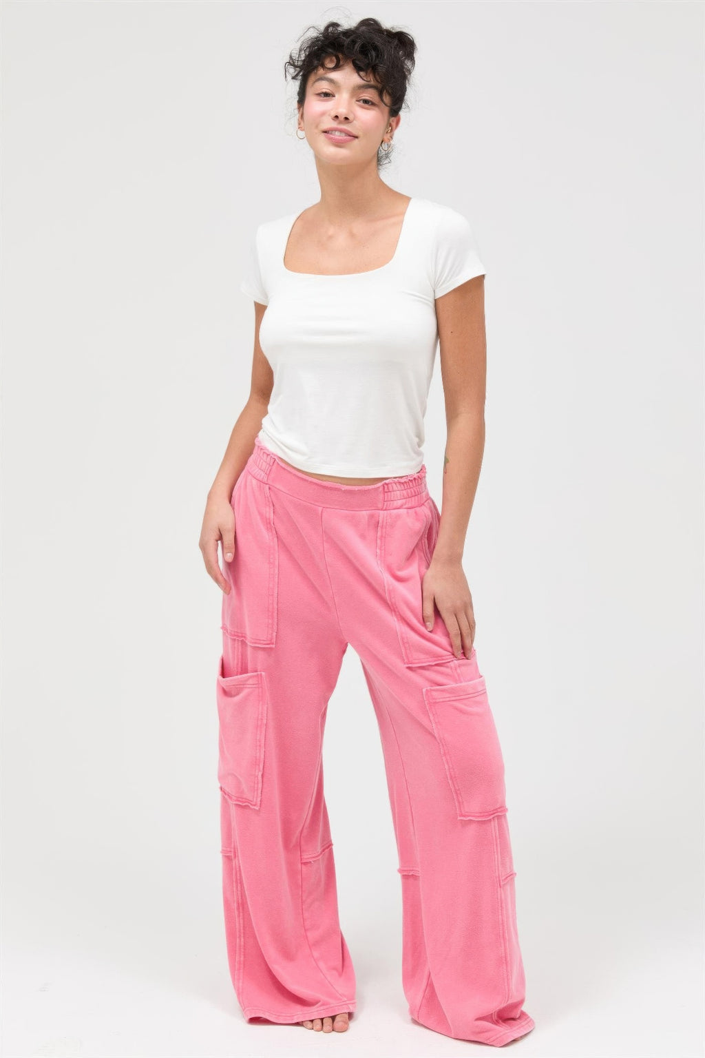 Taffy pink wide-leg cargo pants, full-body view with cargo pockets and elastic waist