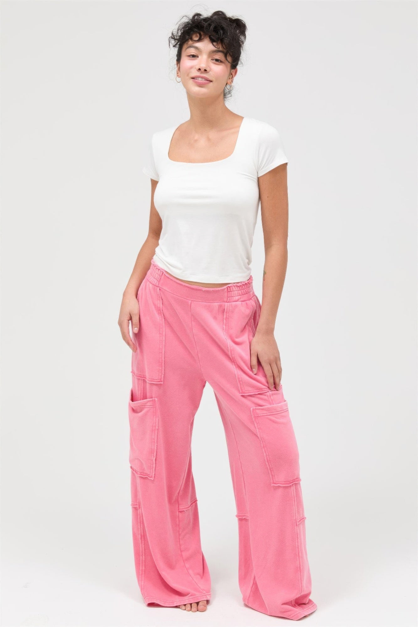 Taffy pink wide-leg cargo pants, full-body view with cargo pockets and elastic waist