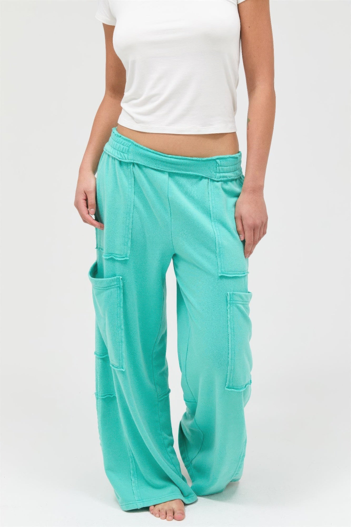 Turquoise mineral-wash wide-leg cargo pants with elastic waist and cargo patch pockets