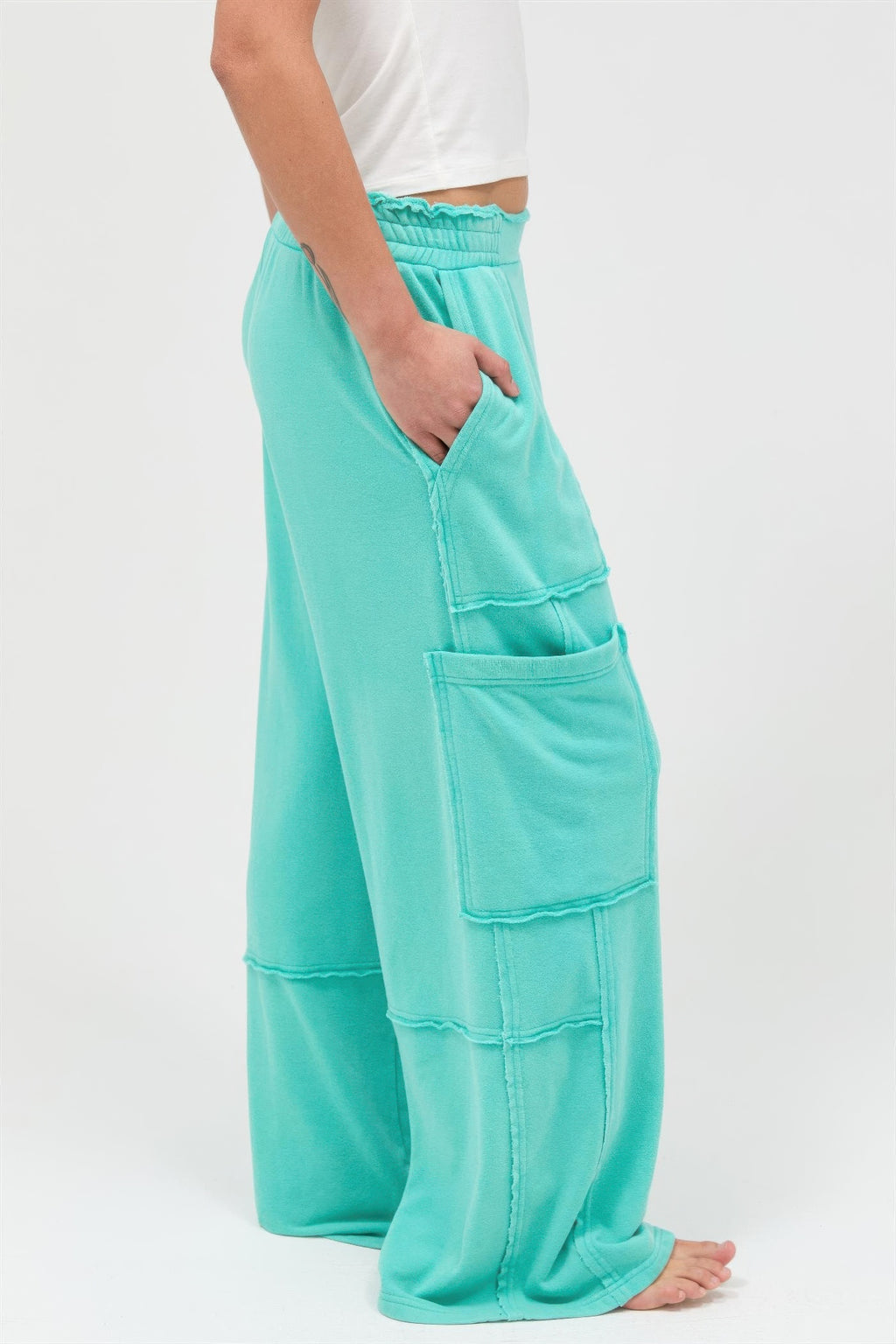Mineral wash wide-leg cargo pants in turquoise, side cargo pocket detail and seam lines