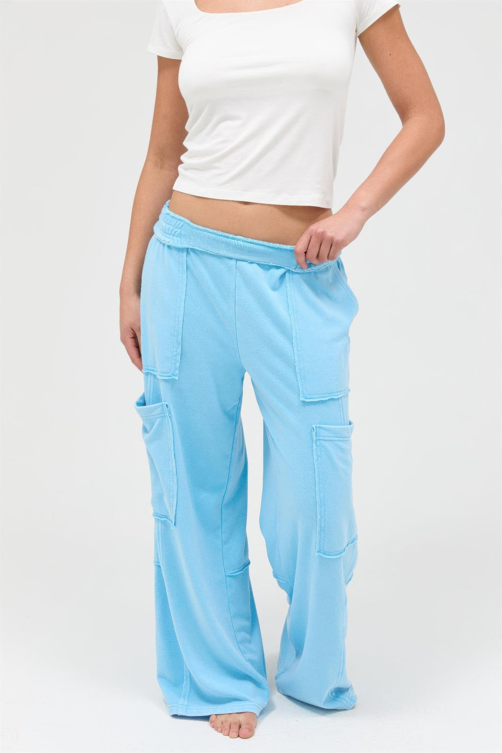 Turquoise blue wide-leg cargo pants, elastic waistband and cargo pockets front view