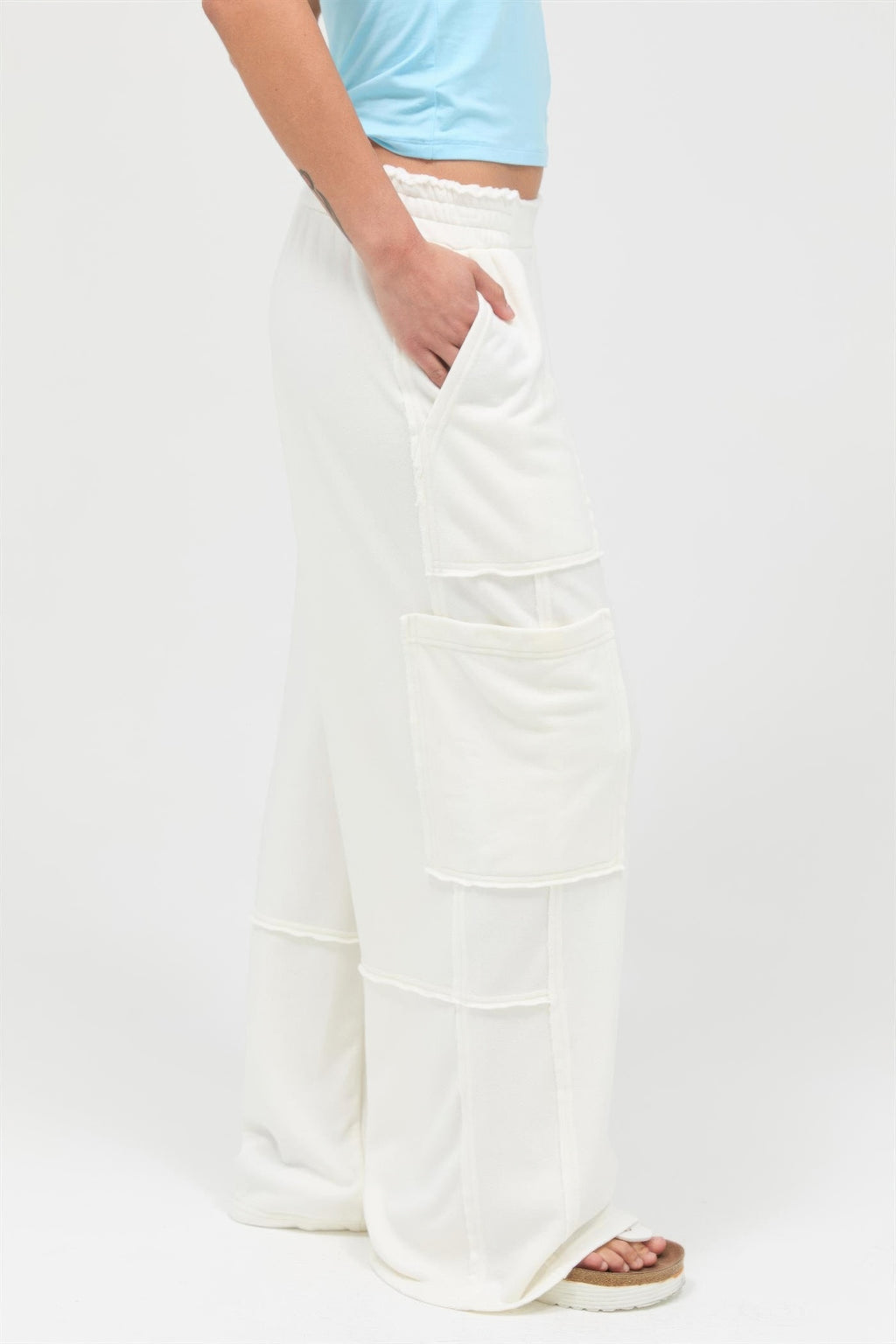 Mineral wash wide-leg cargo pants in cream, side cargo pockets and relaxed wide leg