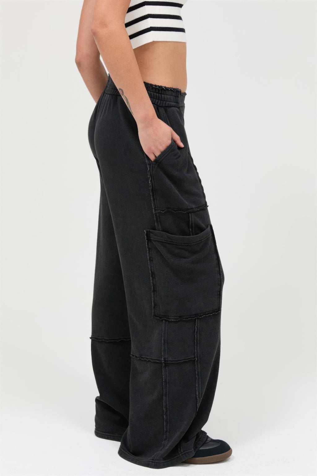 Black wide-leg cargo pants, front and side patch pockets, relaxed fit