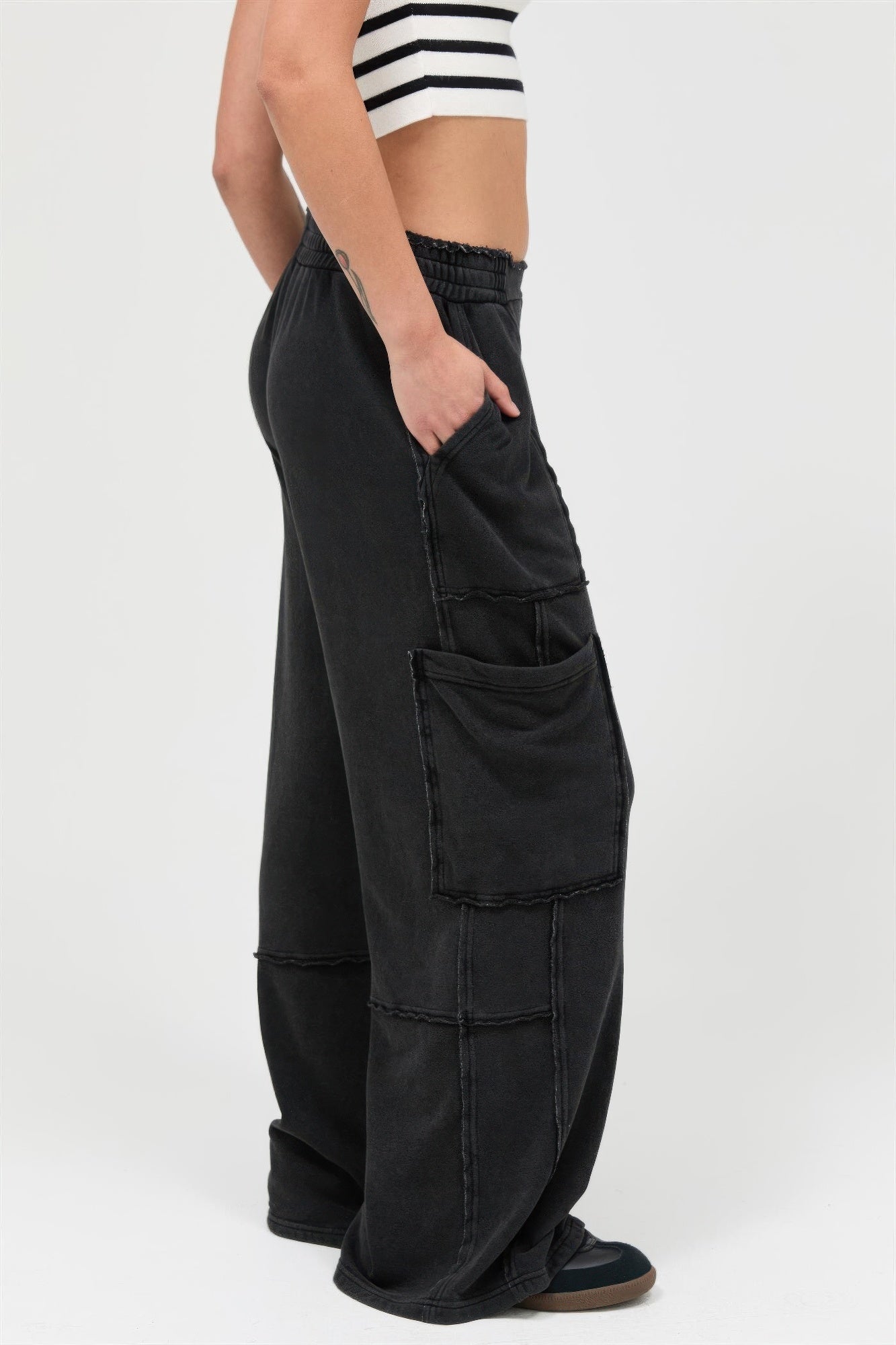 Black wide-leg cargo pants, front and side patch pockets, relaxed fit