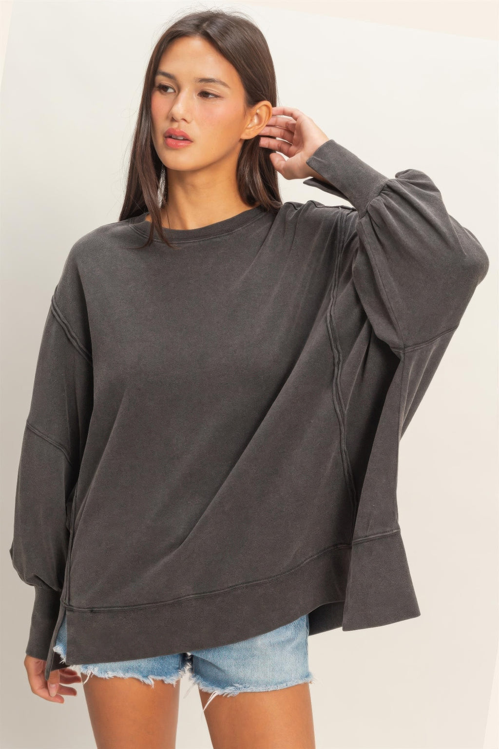 Oversized long sleeve top in dark gray/black with contrast seam stitching
