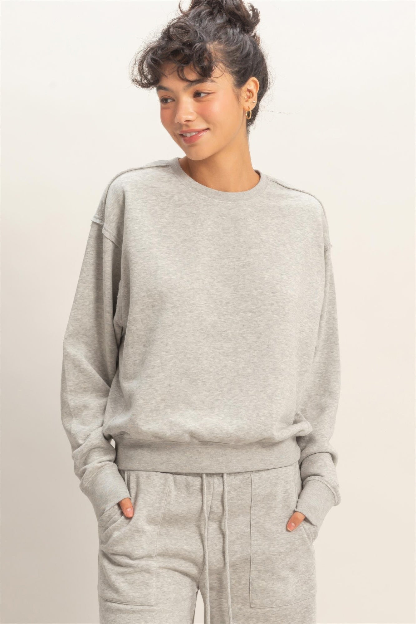 Heather grey raw-edge burnout sweatshirt with crew neck and long sleeves