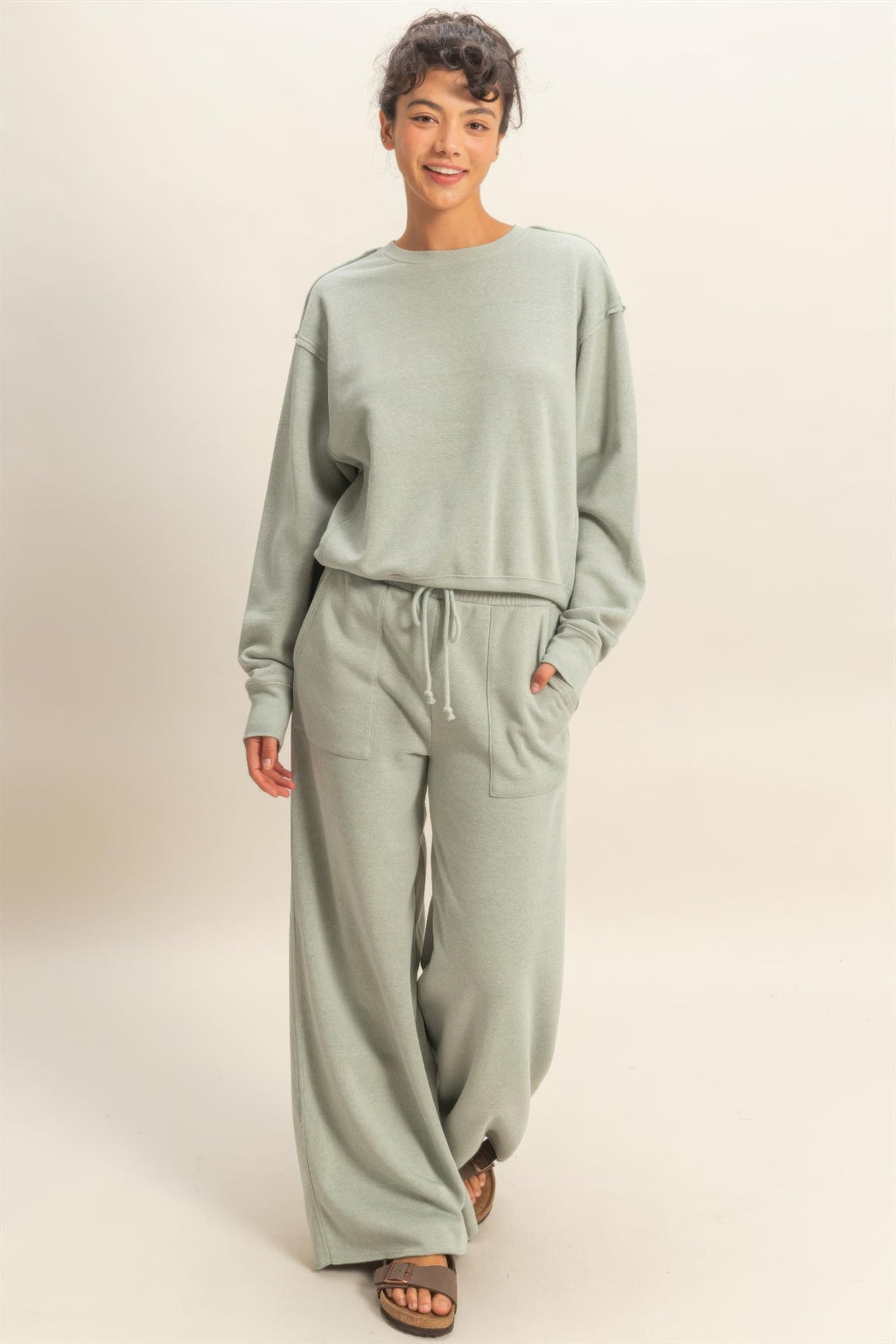 Heather grey raw-edge sweatshirt front view with crew neck and ribbed waist hem
