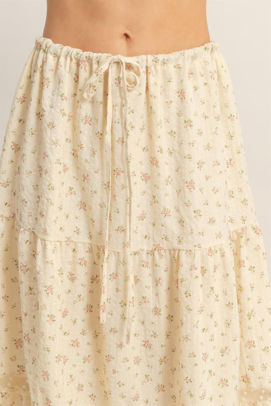 Floral tiered skirt detail: elastic drawstring waist with gathered ruffles