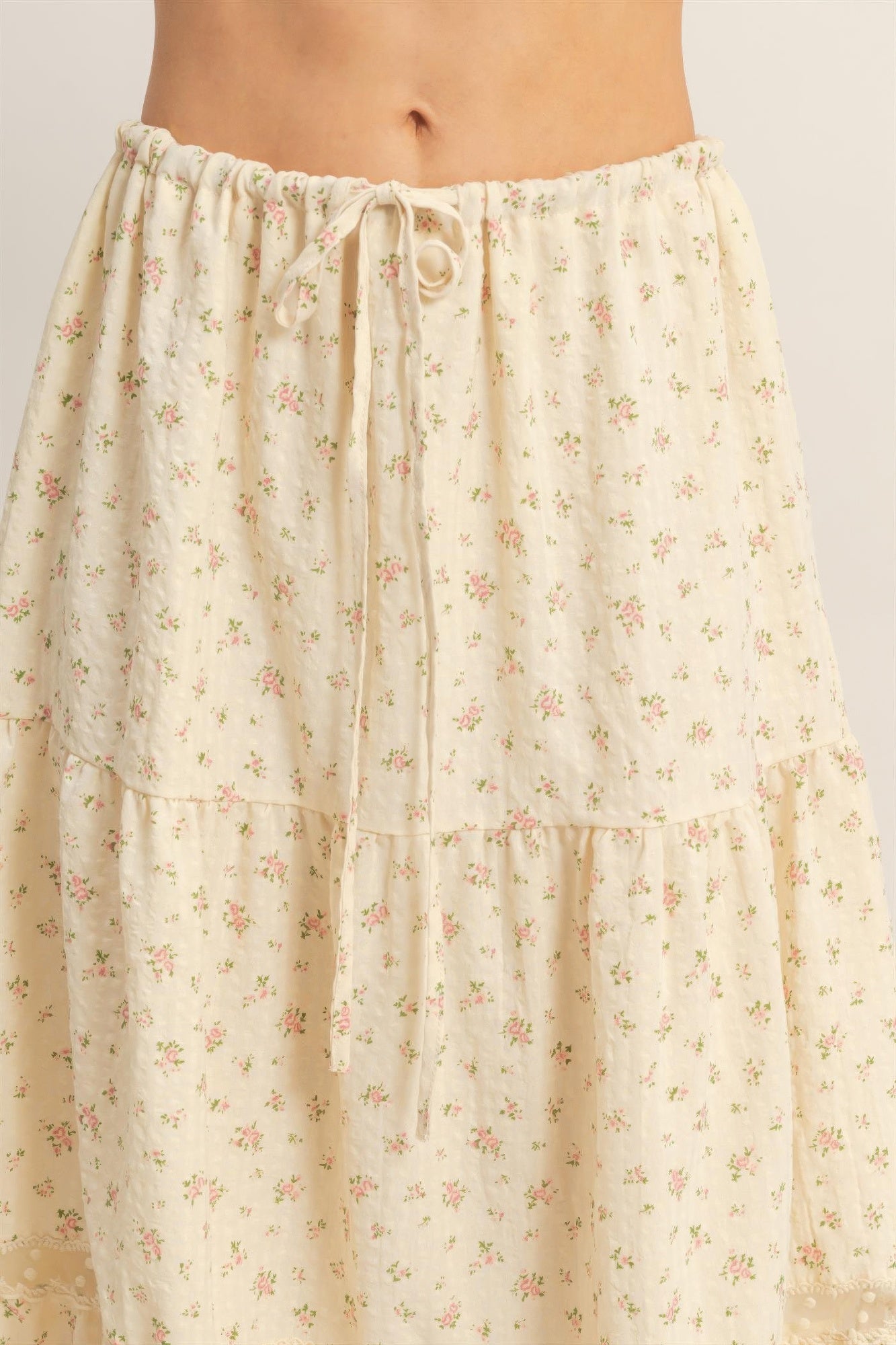 Floral tiered skirt detail: elastic drawstring waist with gathered ruffles