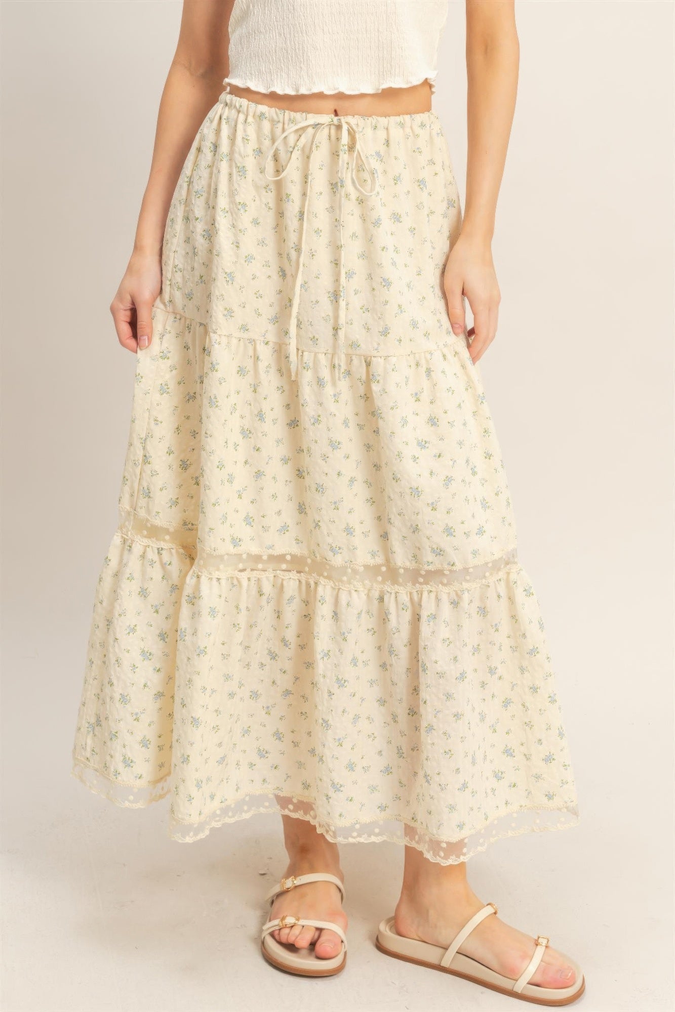Cream tiered skirt with elastic waist, floral print, scalloped lace hem trim