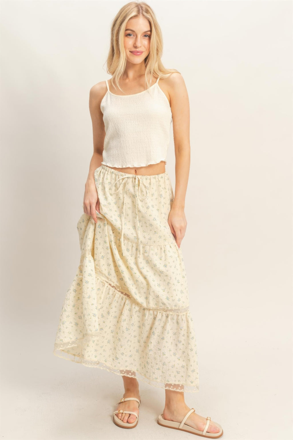 Tiered lace-trim skirt in cream with layered ruffles, small floral pattern