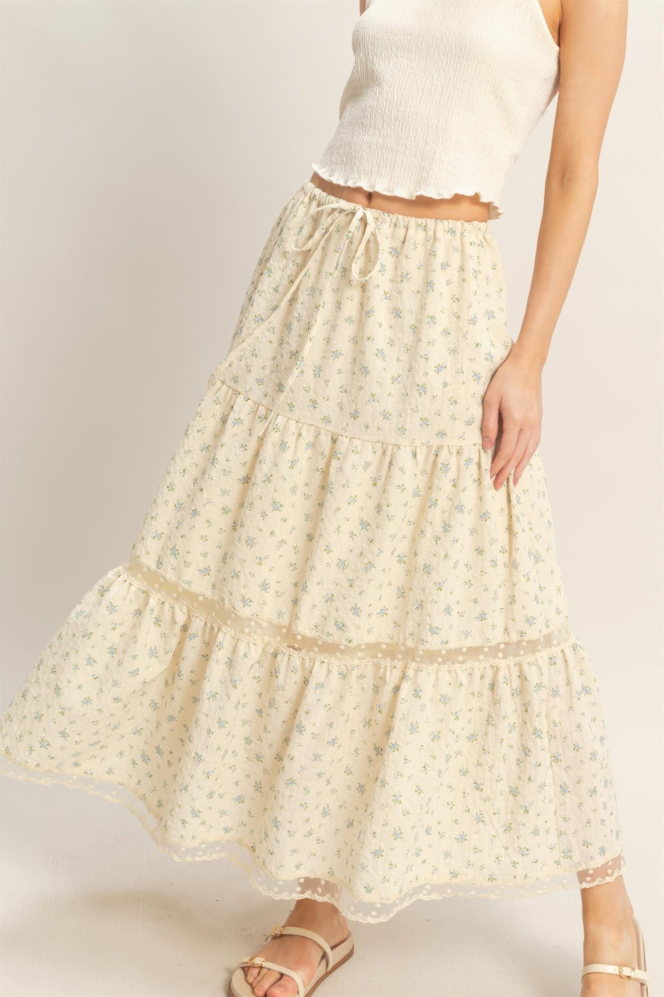 Cream floral tiered skirt with gathered ruffle tiers and scalloped lace hem