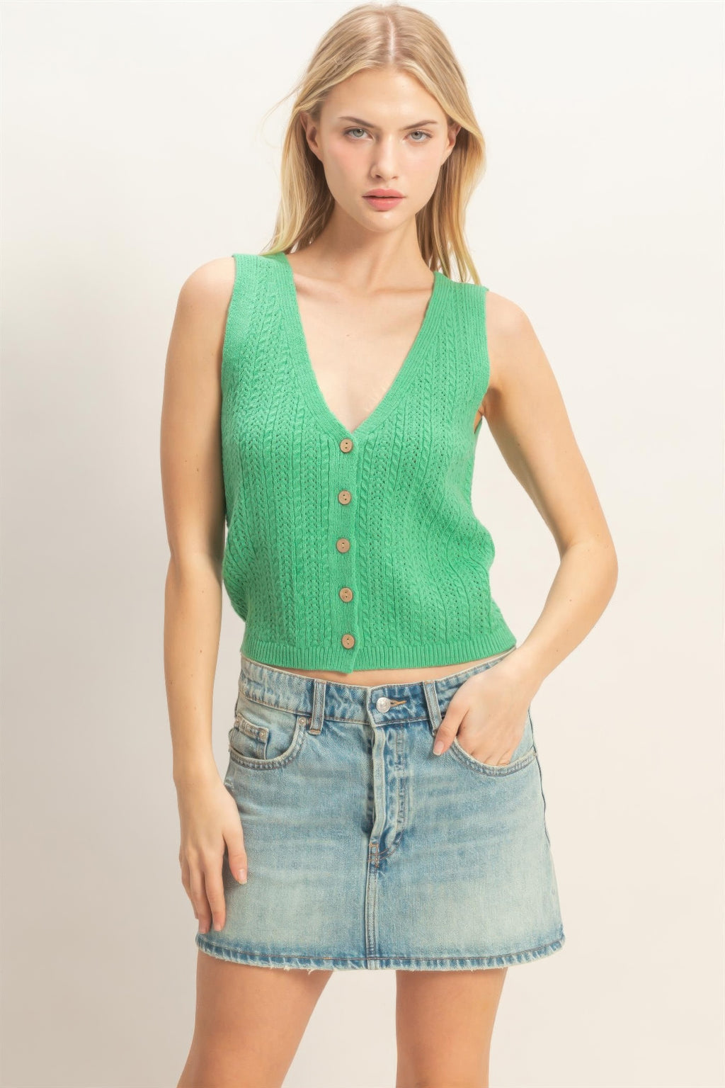 V-neck knit tank top in green with button-front and sleeveless ribbed knit texture