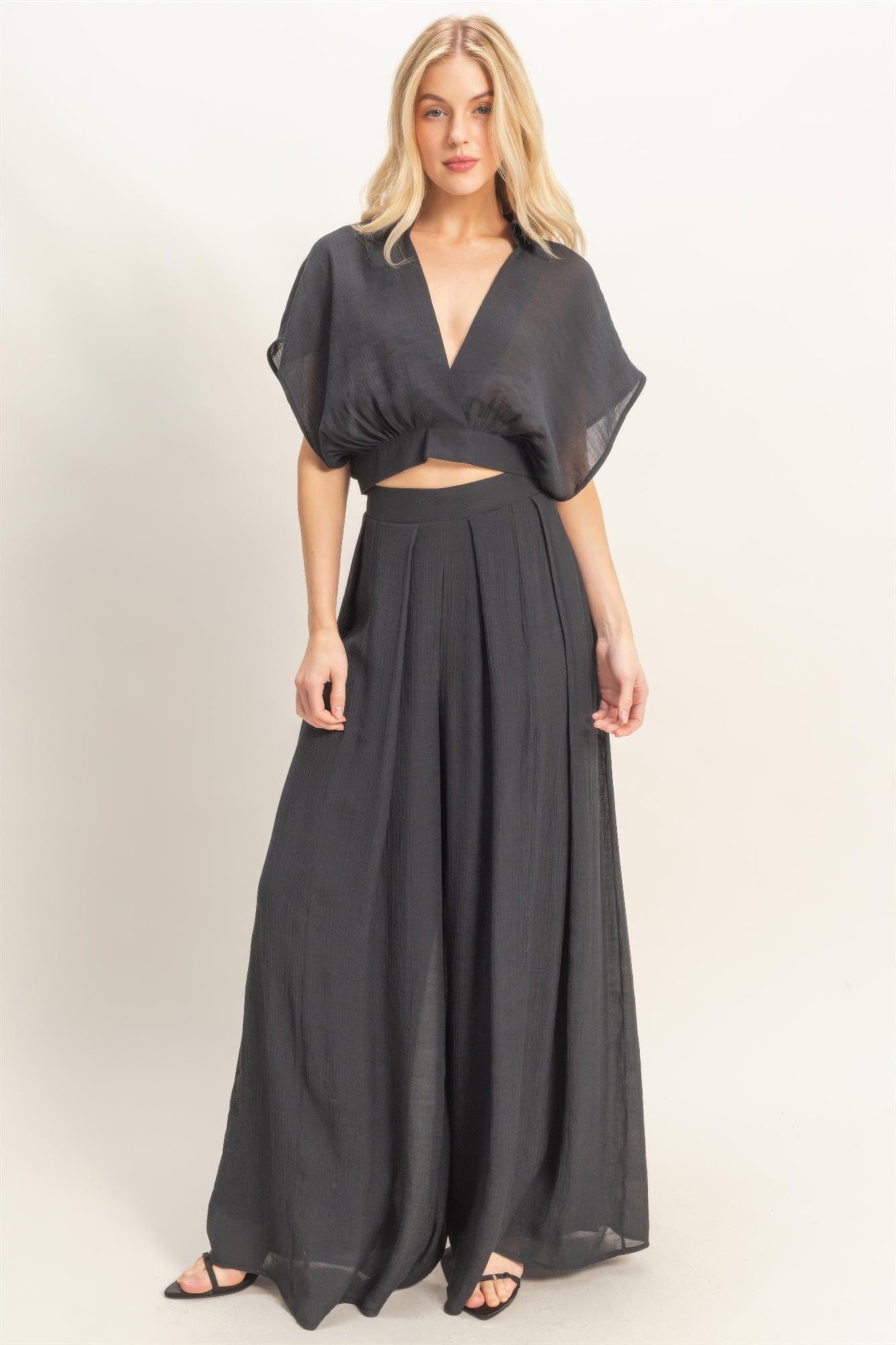 Black collared wrap top and wide-leg pants set, cropped surplice bodice