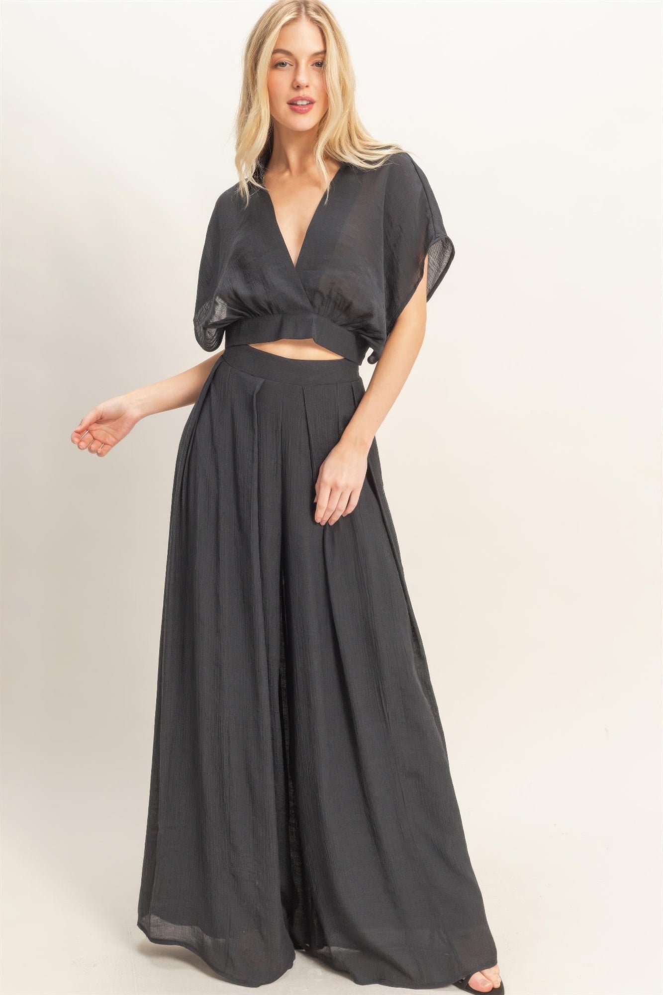 Black collared wrap top and wide-leg pants set with gathered waist and long flowy legs