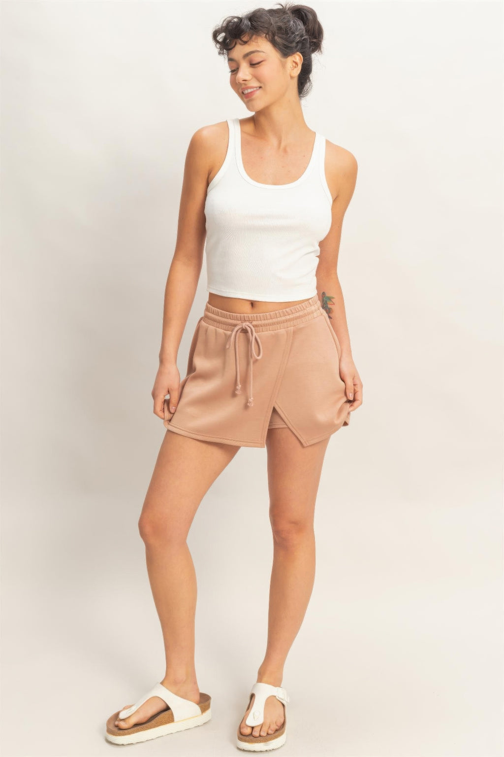 Dusty taupe skort full view: sleeveless crop top paired with wrap-front elastic waist skort