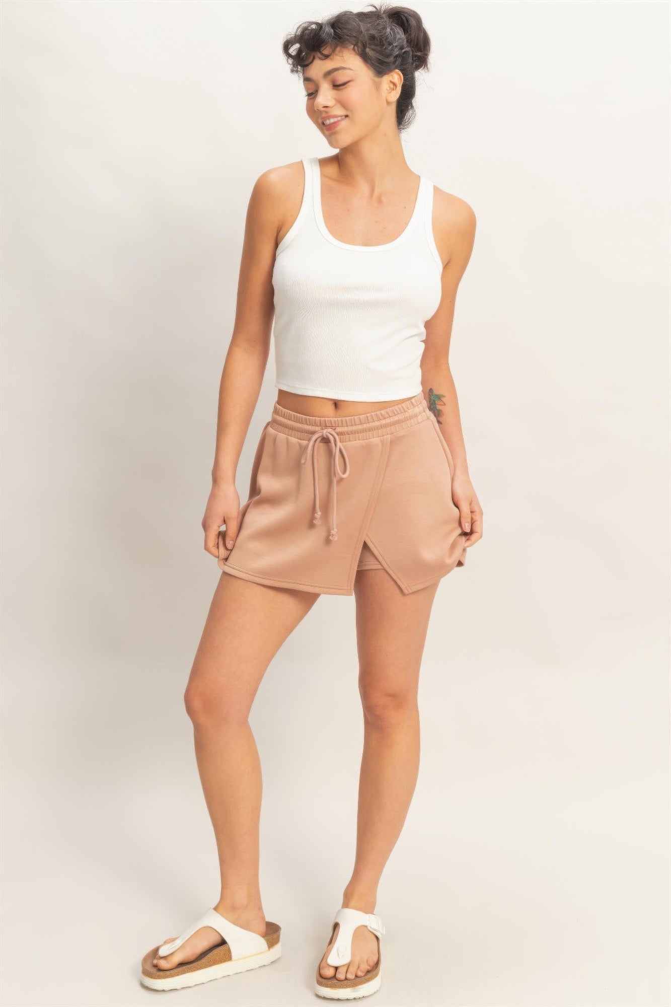 Dusty taupe skort full view: sleeveless crop top paired with wrap-front elastic waist skort