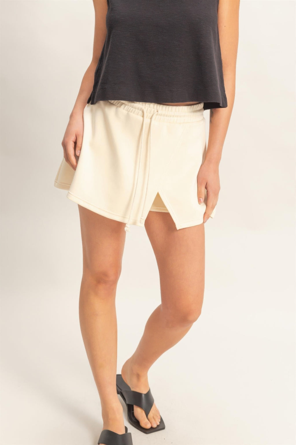 Alpaca wrap-front skort in cream with elastic waist and front slit detail