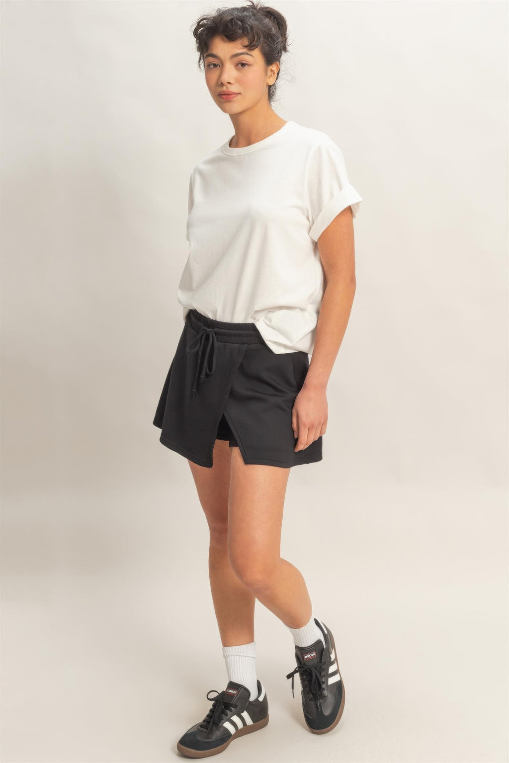 Black skort with elastic waistband and wrap-style front panel