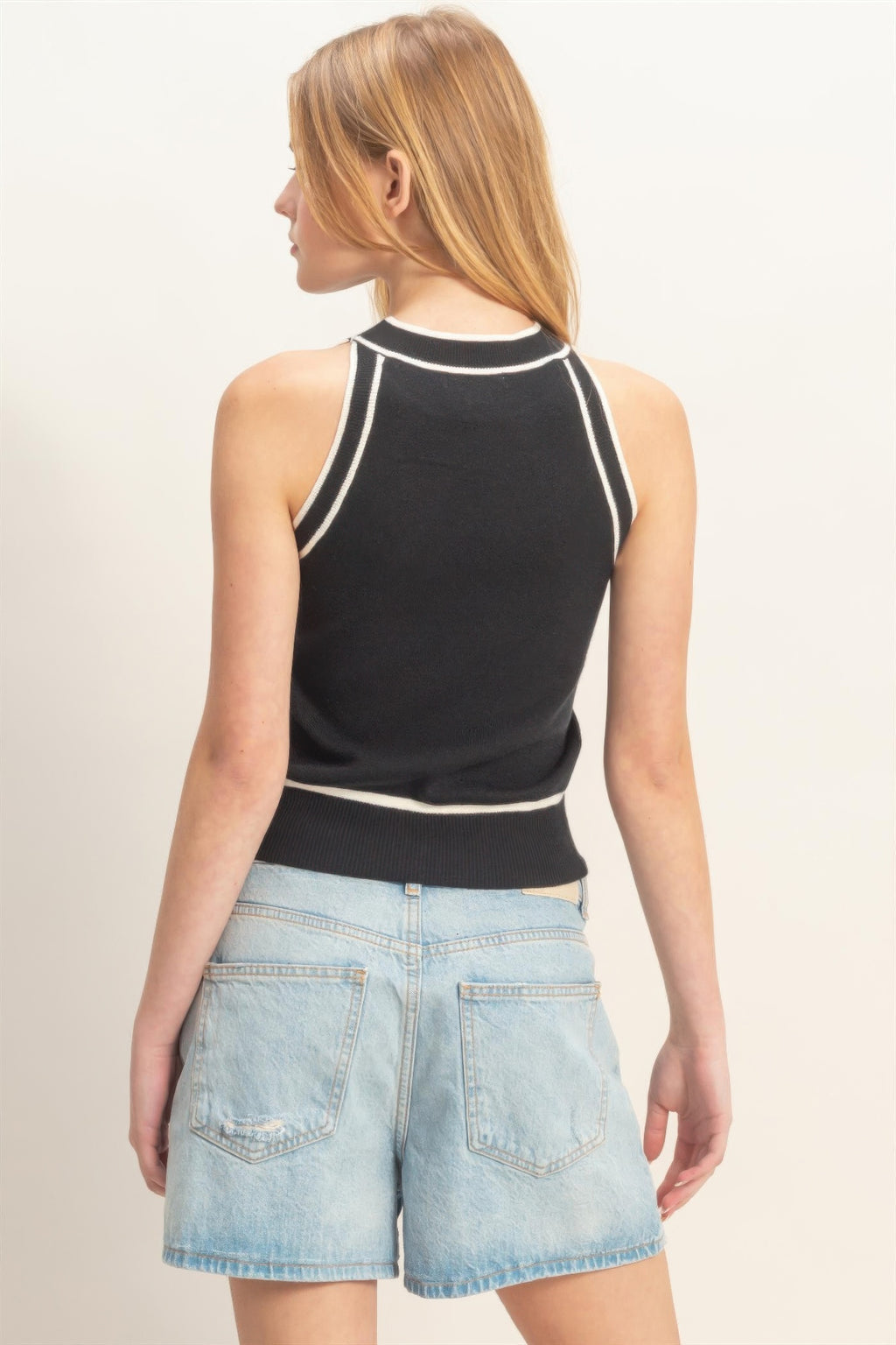 Black sleeveless ribbed top with contrast striped trim at back and ribbed hem