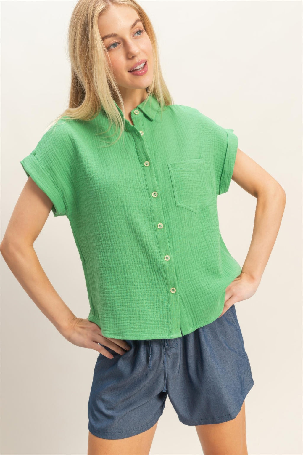 Green rolled-sleeve button-up top, relaxed fit with front chest pocket