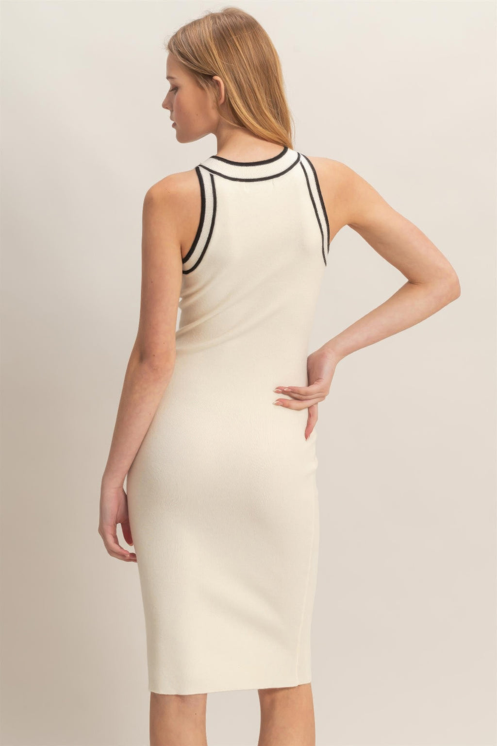 Ribbed sleeveless dress in ivory with black-trim back and slim pencil fit